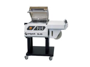 Producción/h: hasta 300 paquetes. Altura máxima producto: 210 mm